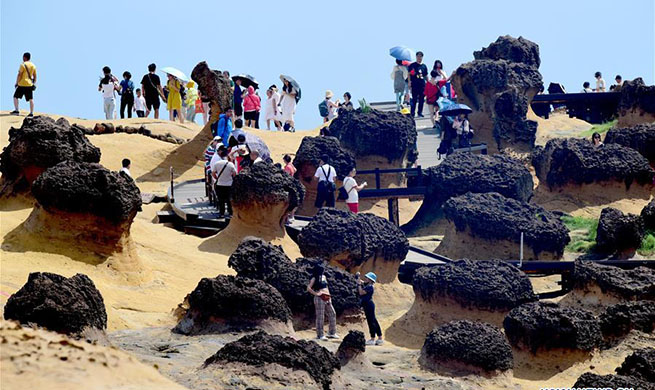 Tourists visit Yehliu Geopark in SE China's Taiwan