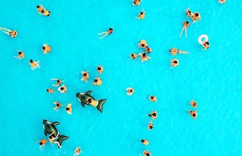 People cool off at waterpark in east China's Jiangsu